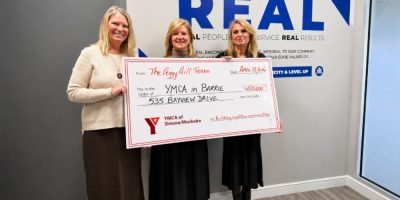 YMCA of Simcoe/Muskoka representatives Jill Tettmann and Karen Pulla accept a $150,000 donation from Peggy Hill of the Peggy Hill Team Real Estate Brokerage Inc. for the new YMCA in Barrie.