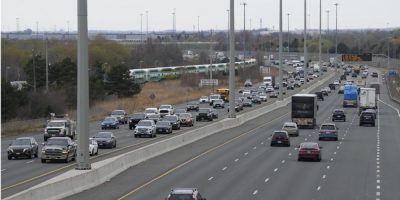 Traffic travels along Highway 401 in Whitby, Ontario, as new auto insurance rules making some accident benefits optional take effect on July 1.