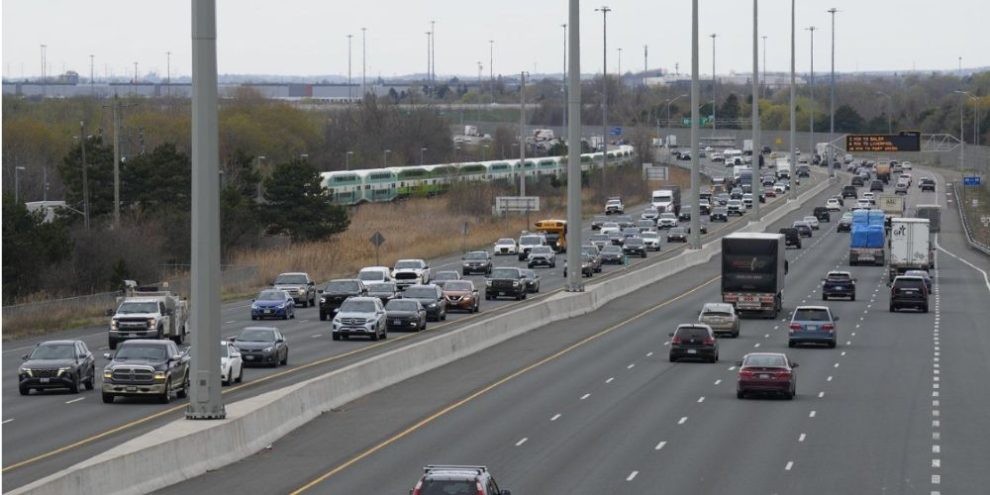 Traffic travels along Highway 401 in Whitby, Ontario, as new auto insurance rules making some accident benefits optional take effect on July 1.