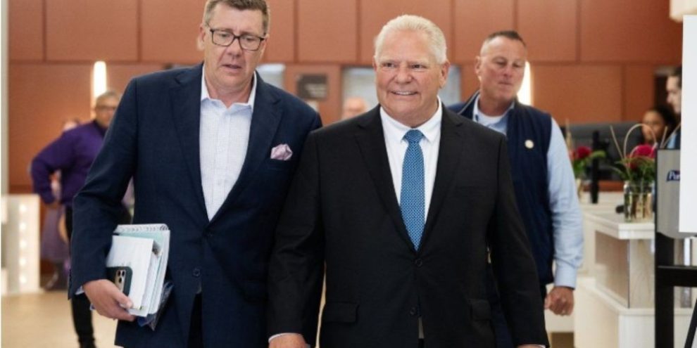 Ontario Premier Doug Ford and Saskatchewan Premier Scott Moe at a Council of the Federation meeting in Charlottetown.