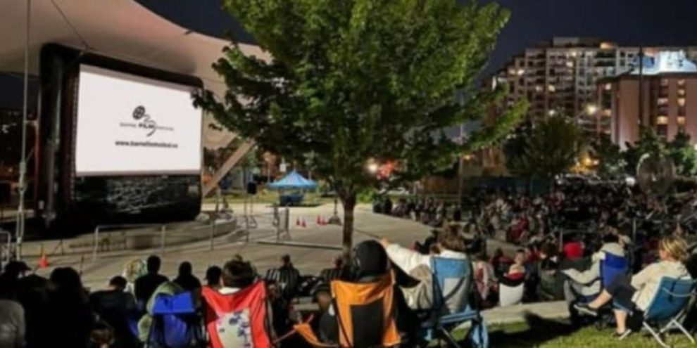 Promotional image for the Lawnchair Luminata Outdoor Movie Series in downtown Barrie featuring free outdoor movies at Meridian Place.