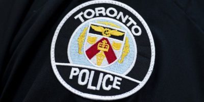 Toronto Police Service logo as officers investigate damage at two Jewish-owned bakery locations.