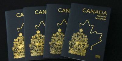 New Canadian passport displayed at an event at Ottawa International Airport in 2023.