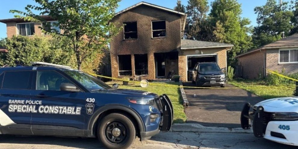Barrie police secure the scene outside a fire-damaged home on Charlbrook Avenue in Barrie's north end as the Ontario Fire Marshal investigates the overnight blaze.