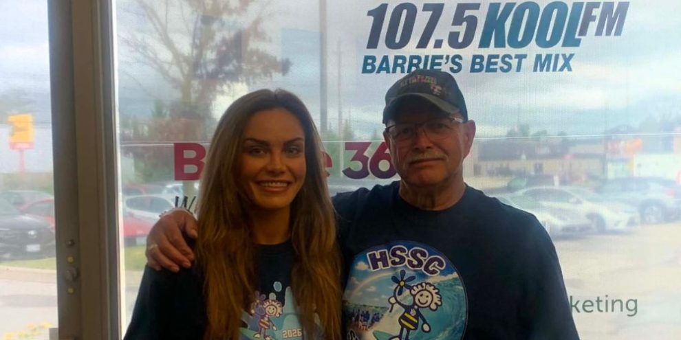 SplashON Water Parks owner Brittany Gallagher and Hospice Simcoe-Seasons Centre's Rowley Ramey promote the 2026 SplashON Wipe Out Challenge at Barrie's Centennial Park waterfront.