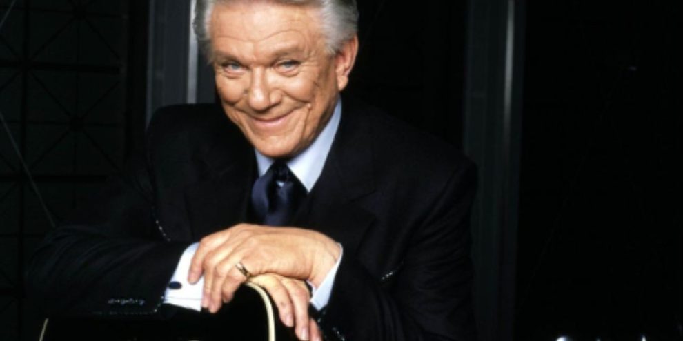 Tommy Hunter holding a guitar in an undated photo. The Canadian country music legend and CBC television host has died at age 89.