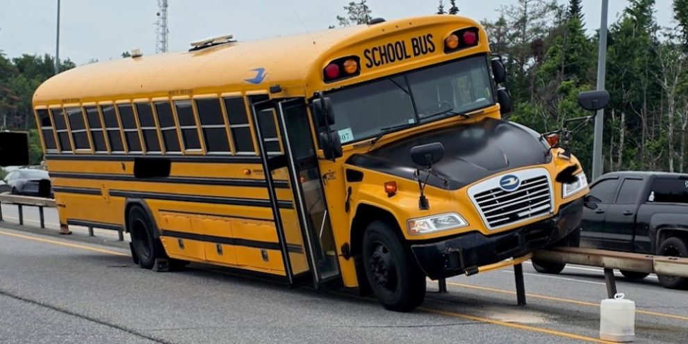 School bus perched on a damaged guardrail along Highway 11 between Line 2 and Line 3 in Oro-Medonte following a collision with a passenger vehicle around 1:40 p.m. on Sunday, July 5, 2026.