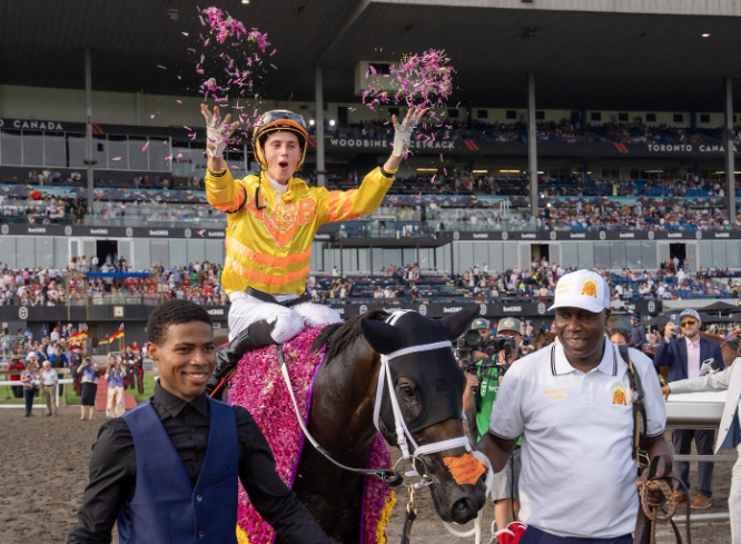 Jockey Pietro Moran rides Mansetti to victory in the King's Plate horse race in Toronto in August 2025.