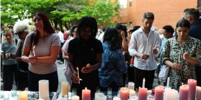 People attend a vigil following the deadly Salsa on St. Clair shooting in Toronto