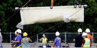 Beluga whale Gemini is transported from Marineland in a sling during a relocation to a U.S. aquarium.