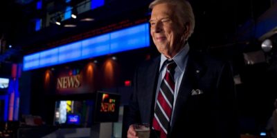 Lloyd Robertson holds a glass of champagne after his final CTV National News broadcast in 2011.