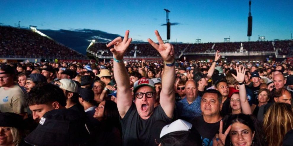 Fans gather to watch Oasis perform during their reunion tour in Toronto