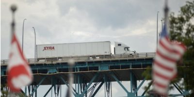 Transport trucks cross the Ambassador Bridge in Windsor, Ontario