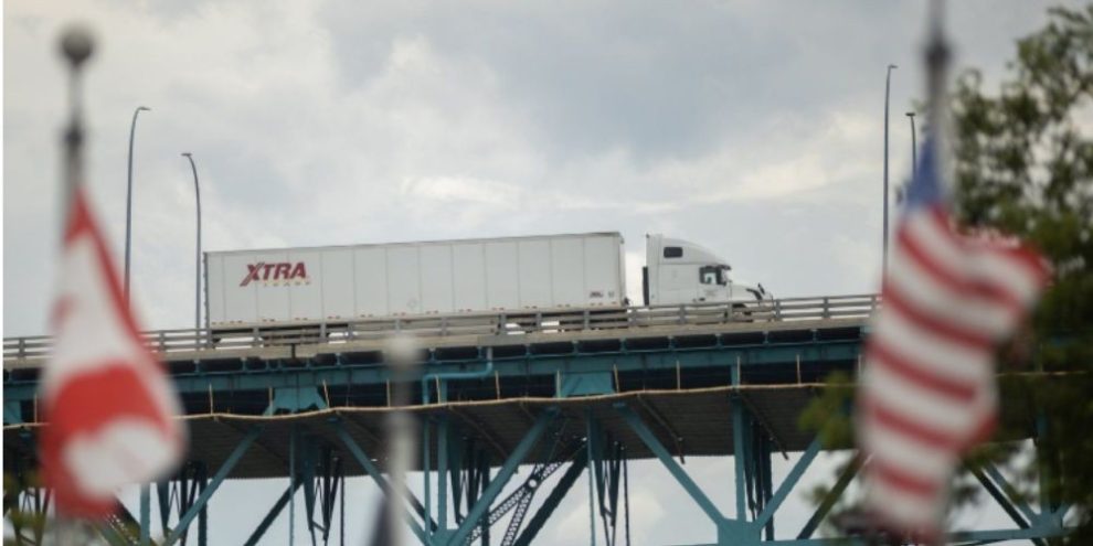 Transport trucks cross the Ambassador Bridge in Windsor, Ontario