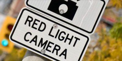 Sign indicating a red light camera