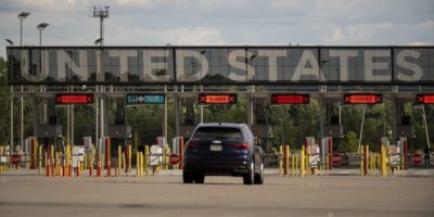 Vehicles approach the U.S.-Canada border at Saint-Bernard-de-Lacolle, Quebec.