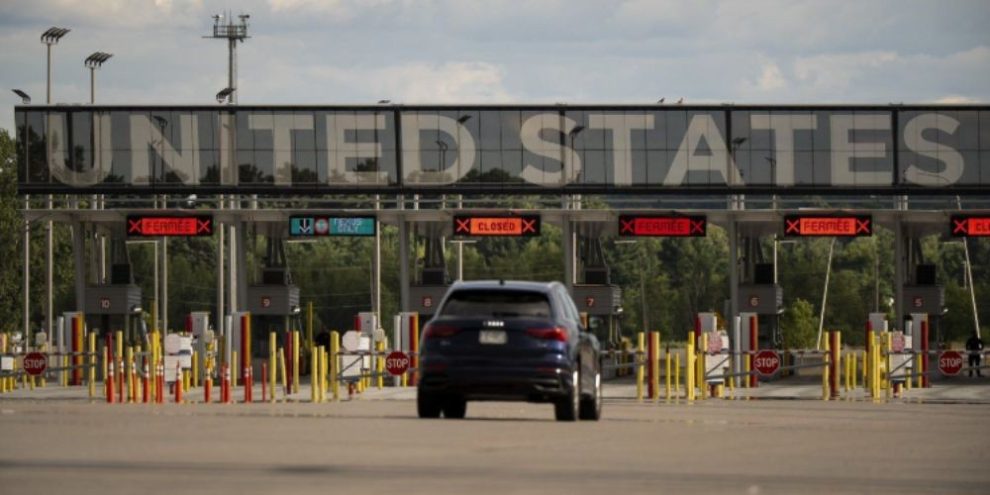 Vehicles approach the U.S.-Canada border at Saint-Bernard-de-Lacolle, Quebec.
