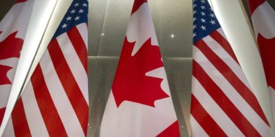 U.S. and Canadian flags displayed before an event in Washington.