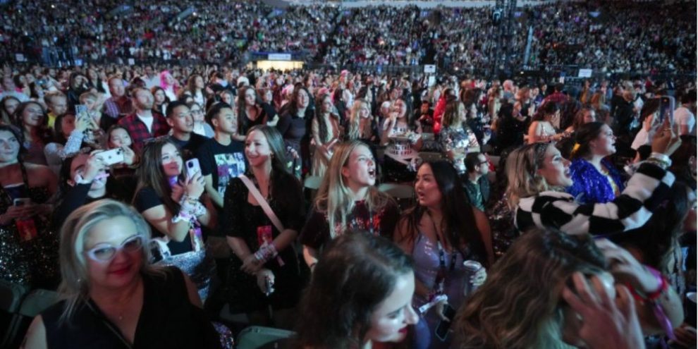 Fans watch Gracie Abrams perform as the opening act before Taylor Swift at the Eras Tour in Vancouver