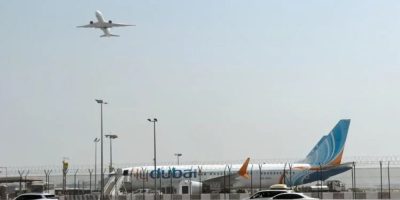 A FlyDubai aircraft sits on the tarmac at Dubai International Airport in Dubai