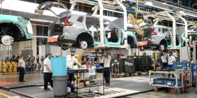 Honda employees work along the vehicle assembly line in Alliston, Ontario, on April 25, 2024.