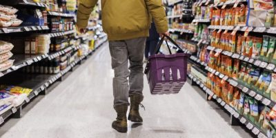 A customer browses a grocery aisle at a Metro store in Toronto on Feb. 2, 2024.