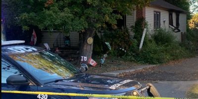 Barrie Police tape at the scene of a house fire on Alfred Street in Barrie on Oct. 2, 2026.
