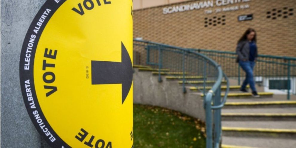 A voter leaves a polling station after casting a ballot in Alberta's referendum in Calgary on Oct. 19, 2026.