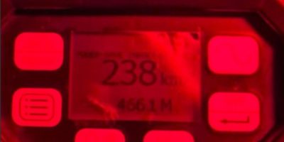 Radar device displaying a speed of 238 km/h.