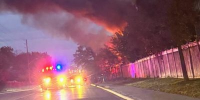 Flames and heavy smoke rise from a house on Livia Herman Way in north Barrie.