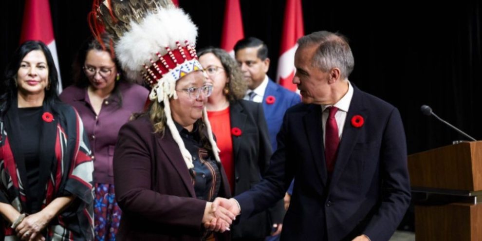 Prime Minister Mark Carney shakes hands with Assembly of First Nations National Chief Cindy Woodhouse Nepinak in Ottawa on Oct. 26, 2026.